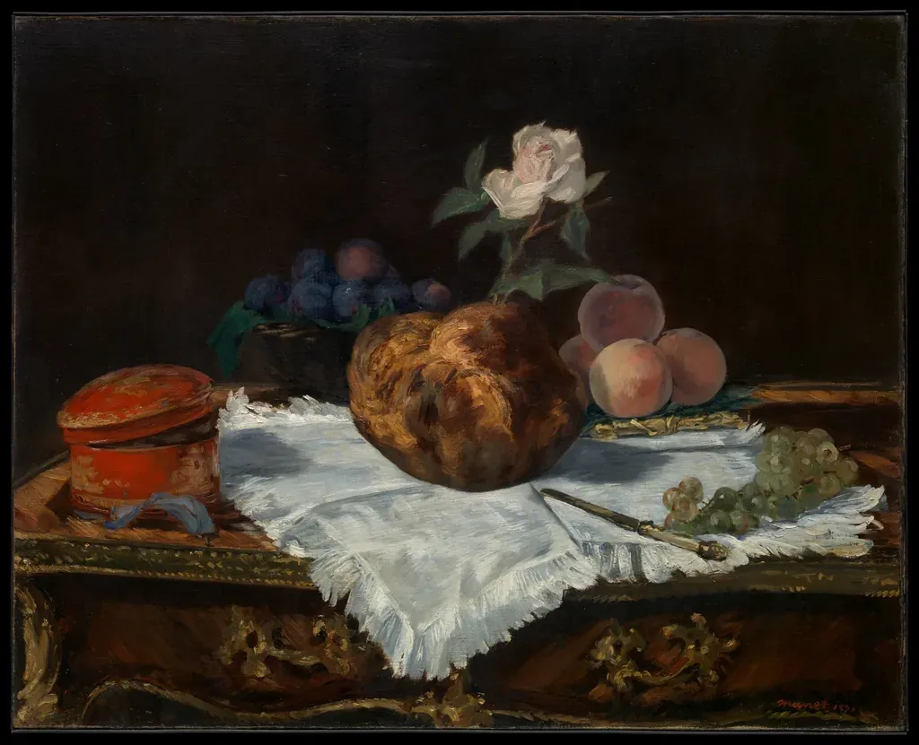 Nature morte : pain et pâtisseries posés sur une nappe blanche